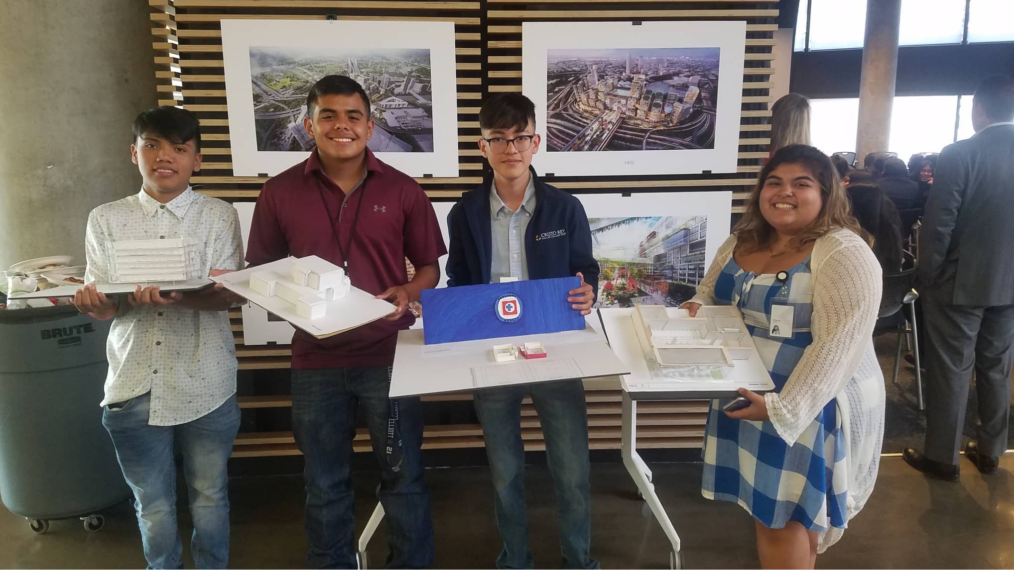 Cristo Rey students show off models they made based on Revit projects at the VIVA Cristo Rey Corporate Work-Study Program freshman tour at HKS headquarters in 2019.
