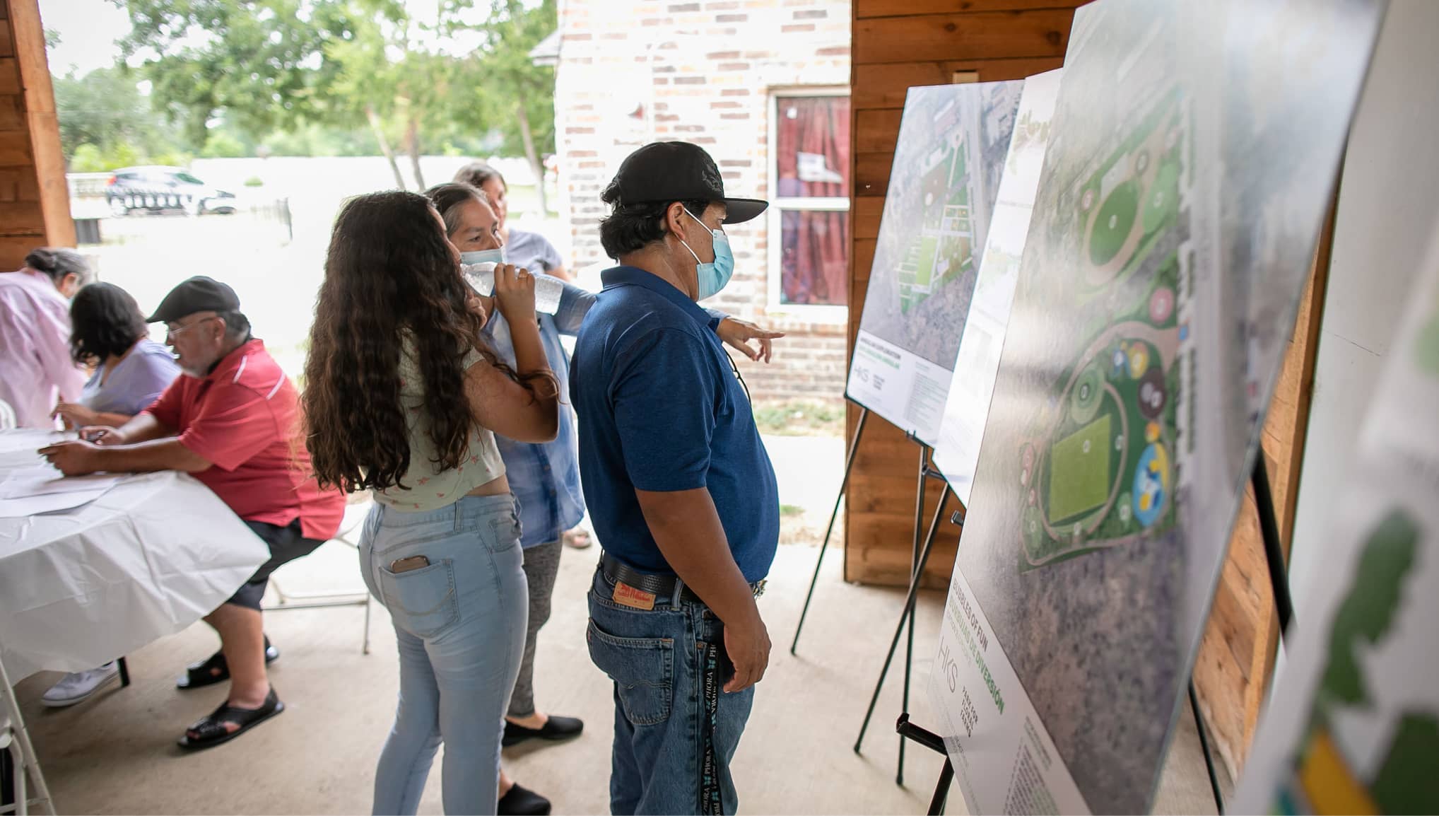 Floral Farms residents review three park concepts before providing feedback on elements that they would like to see included in the final park concept. Many of them brought their children and grandchildren to the meeting, so they too could have a say in the process.